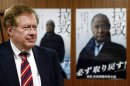 Robert King, U.S. special envoy for North Korean human rights issues, stands in front of campaign posters during a meeting in Tokyo