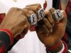 From left, Miami Heat's Dwyane Wade, Chris Bosh and LeBron James pose with their 2012 NBA Finals championship rings during a ceremony before a basketball game against the Boston Celtics, Tuesday, Oct. 30, 2012, in Miami. (AP Photo/The Miami Herald, Charles Trainor Jr.)  MAGS OUT