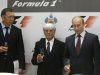 FILE - In this Thursday, Oct. 14, 2010 file photo, then, Russian Prime Minister Vladimir Putin, second right, Formula One chief Bernie Ecclestone, second left, and Oleg Deripaska, toast after a signing ceremony in the Black Sea resort of Sochi, southern Russia. Oleg Deripaska's Basic Element, insists its projects were all designed to be profitable. The company is building an Olympic village and a seaport and has just finished revamping the Sochi airport, for a combined cost of $1.4 billion. (AP Photo/Mikhail Metzel, File)