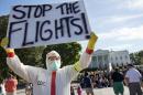 Jeff Hulbert, of Annapolis, Md., protests U.S. handling of Ebola cases outside of the White House Friday, Oct. 17, 2014, in Washington. (AP Photo/Jacquelyn Martin)