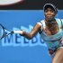 Venus Williams of the U.S. hits a return to Galina Voskoboeva of Kazakhstan during their women's singles match at the Australian Open tennis tournament in Melbourne