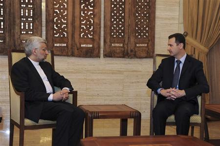 Syria's President Bashar al-Assad (R) meets Iran's Supreme National Security Council Secretary Saeed Jalili in Damascus February 3, 2013, in this handout photograph released by Syria's national news agency SANA. REUTERS/Sana