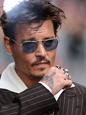 Johnny Depp crow tattoo