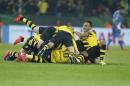 Dortmund players celebrate after scoring in extra time during the German soccer cup (DFB Pokal) quarterfinal match between BvB Borussia Dortmund and TSG 1899 Hoffenheim Tuesday, April 7, 2015 in Dortmund, Germany. (AP Photo/Frank Augstein)