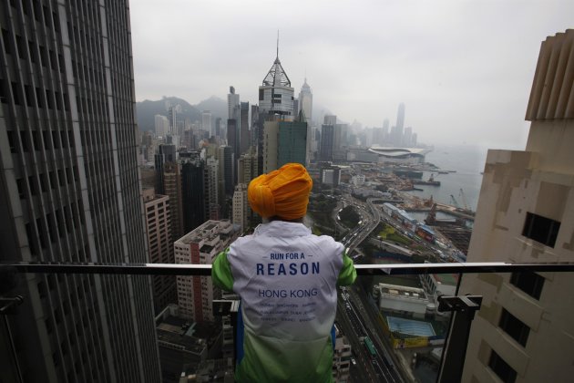 British Indian marathon runner Singh looks at the view in Hong Kong