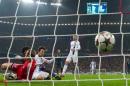 Manchester City's Spanish midfielder David Silva (C) scores past Bayern Munich's goalkeeper Manuel Neuer (L) in Munich, southern Germany, on December 10, 2013