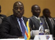 Democratic Republic of Congo's President Joseph Kabila (L) listens to deliberations during the International Conference on the Great Lakes
   Region




 (ICGLR)


 at


 the


 Commonwealth

 Resort
 Hotel Munyonyo in the capital of Kampala August 8, 2012. African leaders of the
 Great Lakes region say they will impose sanctions on any party obstructing peace in the volatile Democratic Republic of Congo on Wednesday. The decision was reached at the end of a two-day leaders summit on the conflict in Uganda. REUTERS/Edward Echwalu
