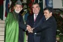 Afghan President Karzai, Tajikistan President Rakhmon and Iranian President Ahmadinejad pose for pictures during a meeting in Dushanbe