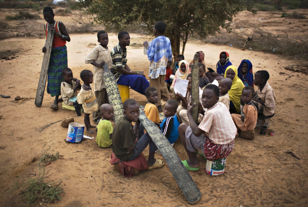 Somali children attend a makeshift outdoor classroom at Dagahaley refugee camp in Dadaab in Kenya