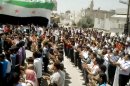 In this image made from amateur video released by the Shaam News Network and accessed Wednesday, May 23, 2012, purports to show Syrians chanting slogans during a demonstration in Idlib, Syria. (AP Photo/Shaam News Network via AP video) TV OUT, THE ASSOCIATED PRESS CANNOT INDEPENDENTLY VERIFY THE CONTENT, DATE, LOCATION OR AUTHENTICITY OF THIS MATERIAL