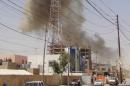 Smoke rises after a bomb attack in the city of Ramadi