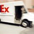 A delivery truck returns to a FedEx sort facility in Boston