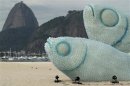 Giant fish made with plastic bottles are exhibited at Botafogo beach, in Rio de Janeiro