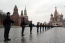 File photo shows a cordon of interior ministry troops in in front of the Kremlin (L) and St. Basil's Cathedral (R) in Moscow's Red Square on December 10, 2011
