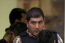 The alleged leader of a faction of the hyper-violent Zetas cartel, Ivan Velazquez Caballero, known as "El Taliban," is escorted to a media presentation at the Mexican Navy's Center for Advanced Naval Studies in Mexico City,Thursday, Sept. 27, 2012. Velazquez Caballero allegedly has been fighting a bloody internal battle with top Zetas' leader Miguel Angel Trevino Morales, and officials have said the split was behind a recent surge in massacres and shootouts, particularly in northern Mexico. (AP Photo/Eduardo Verdugo)