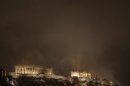 Acropolis hill with Parthenon temple is covered with smoke during during a violent demonstration in central Athens
