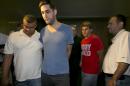 Daniel Petryszyn, second left, and Bryan Caputo, third left, are escorted to their arraignment proceedings in New York state Supreme Court, Wednesday, July 23, 2014. They are two of six people who were indicted Wednesday in an international ring that took over more than 1,600 StubHub users' accounts and fraudulently bought tickets to such prime events as Jay-Z and Elton John concerts and Broadway shows like "The Book of Mormon," the Manhattan district attorney said Wednesday. (AP Photo)