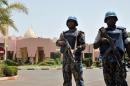 UN peacekeeper police officers stand guard at entrance of Hotel Salem in Bamako, Mali, on March 8, 2015