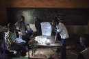 Poll workers count ballots in Bamako