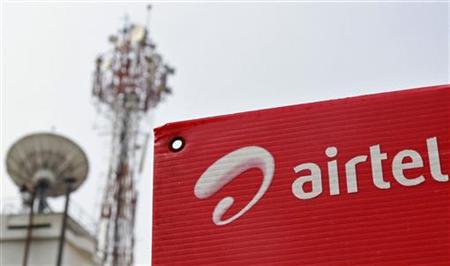 A Bharti Airtel advertisement board is installed against the backdrop of company's telecommunication tower in Kochi