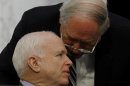 Senators Levin and McCain confer at the Senate Armed Services Committee in Washington