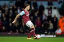 West Ham's Mark Noble scores his side's third goal from a penalty during the English Premier League soccer match between West Ham and Watford at Upton Park stadium in London, Wednesday, April 20, 2016. (AP Photo/Matt Dunham)