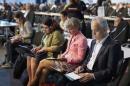 Delegates take notes during a plenary session of the U.N. Climate Change Conference COP 20 in Lima