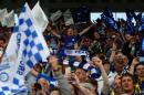 Leicester City fans celebrate after winning the league and the English Premier League football match between Leicester City and Everton at King Power Stadium in Leicester, central England on May 7, 2016
