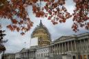 FILE - This Nov. 13, 2014, file photo shows the U.S. Capitol Dome, in Washington, surrounded by scaffolding for a long-term repair project, and framed by the last of autumn's colorful leaves. Like a student who waited until the night before a deadline, lawmakers resuming work Monday will try to cram two years of leftover business into two weeks while avoiding a government shutdown. (AP Photo/J. Scott Applewhite, File)