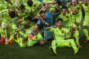 Barcelona's players celebrate their championship after a Spanish La Liga soccer match between Atletico Madrid and FC Barcelona at the Vicente Calderon stadium in Madrid, Spain, Sunday, May 17, 2015. (AP Photo/Andres Kudacki)