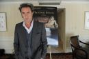 Italian director Paolo Sorrentino poses for a photo at a hotel in Beverly Hills, California October 29, 2013