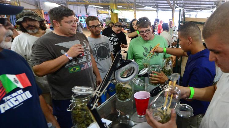 Marijuana is weighed at Los Angeles, California's first-ever cannabis farmer's market at the West Coast Collective medical marijuana dispensary on July 4, 2014