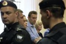 Russian protest leader Alexei Navalny stands inside a courtroom in Kirov