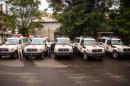 Five ambulances that were donated by the U.S. to help combat the Ebola virus are lined up following a ceremony attended by Sierra Leone's president Ernest Bai Koroma, in Freetown, Sierra Leone, Wednesday, Sept. 10, 2014. The United States donated five ambulances Wednesday to help Sierra Leone's fight against Ebola, as the West African government acknowledged it can take up to 24 hours to pick up bodies in the spiraling crisis. (AP Photo/Michael Duff)