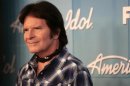 Singer John Fogerty poses in the backroom after performing at the 11th season finale of "American Idol" in Los Angeles