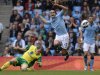 Norwich City's Whittaker challenges Manchester City's Rodwell during their English Premier League soccer match in Manchester
