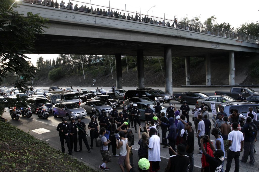 A crowd of demonstrators block traffic on the Interstate 10 freeway while protesting the acquittal of George Zimmerman in the Trayvon Martin trial, in Los Angeles