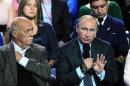 Russian President Vladimir Putin, right, speaks during a meeting with his supporters in Moscow, Russia, Monday, Sept. 7, 2015 Putin took part in a discussion on Monday of a health care reform with his supporters who form All-Russian People's Front. Stanislav Govorukhin, Russian lawmaker and movie director sits at left. (Mikhail Klimentyev/RIA-Novosti, Kremlin Pool Photo via AP)