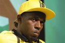Jamaican sprinter Usain Bolt looks on during a team news conference in east London