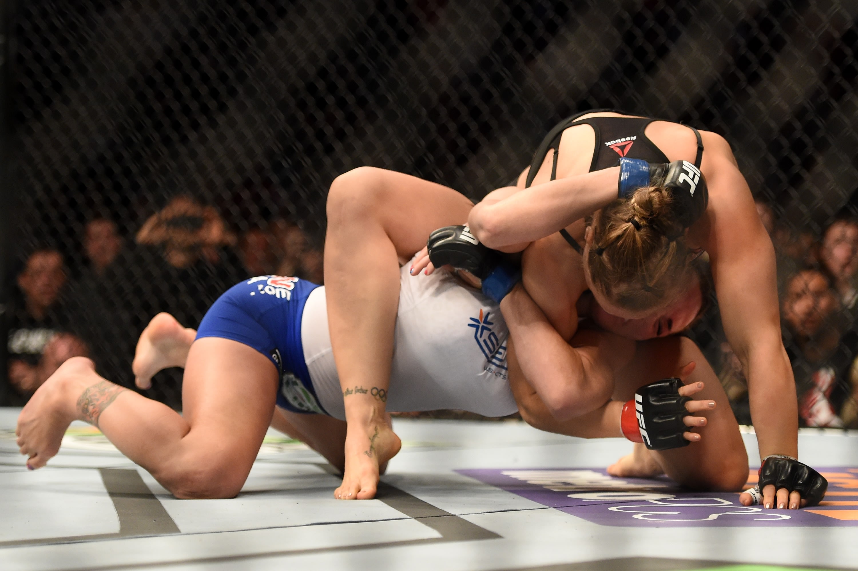 Ronda Rousey (top) made quick work of Cat Zingano in February. (Getty)