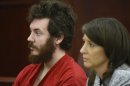 James Holmes sits with defense attorney Tamara Brady during his arraignment in district court in Centennial, Colo., on Tuesday, March 12, 2013. Judge William Blair Sylvester entered a not guilty plea on behalf of James Holmes on Tuesday after the former graduate student's defense team said he was not ready to enter one. (AP Photo/Denver Post, RJ Sangosti, Pool)