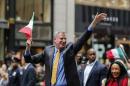 New York Mayor Bill de Blasio waves to the people while he attends the 70th Annual Columbus Day Parade in New York