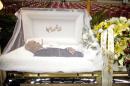 The body of Cheo Feliciano lies in an open casket during his funeral at the San Juan Coliseum in Puerto Rico, Saturday April 19, 2014. Feliciano, a member of the Fania All Stars died in a car crash early Thursday morning when he hit a light post before dawn in the northern suburb of Cupey in San Juan. (AP Photo/Ricardo Arduengo)