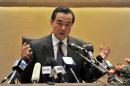 Chinese Foreign Minister Wang Yi speaks at a press conference in Algiers on December 21, 2013 during an official visit