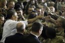 FILE -In this May 2, 2012 file photo, President Barack Obama greets troops at Bagram Air Field, Afghanistan. As slogans go, President Barack Obama's promise of the 