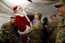 U.S. soldiers enjoy a Christmas dinner at an army base in Karamless town,east of Mosul