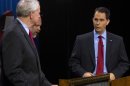 Republican Wisconsin Gov. Scott Walker, who is facing a recall election, faces off against democratic challenger and Milwaukee Mayor Tom Barrett before the start of the debate in Milwaukee