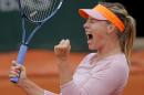 Russia's Maria Sharapova reacts as she plays Australia's Samantha Stosur during their fourth round match of the French Open tennis tournament at the Roland Garros stadium, in Paris, France, Sunday, June 1, 2014. (AP Photo/Michel Spingler)