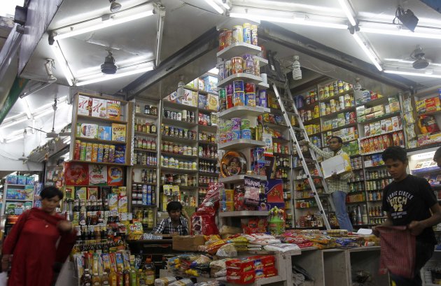 Customers shop in a family-owned store at a market in New Delhi