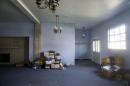 A view of the inside of the former Minus Funeral Home in Dover, Del., Thursday, Aug. 7, 2014, where police say the cremated remains of nine victims of a 1978 mass cult suicide-murder in Jonestown, Guyana were discovered. The state Division of Forensic Science has taken possession of the remains, discovered at the former Minus Funeral Home in Dover, and is working to make identifications and notify relatives, the agency and Dover police said in a statement. The division last week responded to a request to check the former funeral home after 38 containers of remains were discovered inside. Thirty-three containers were marked and identified. They spanned a period from about 1970 to the 1990s and included the Jonestown remains. (AP Photo/Evan Vucci)